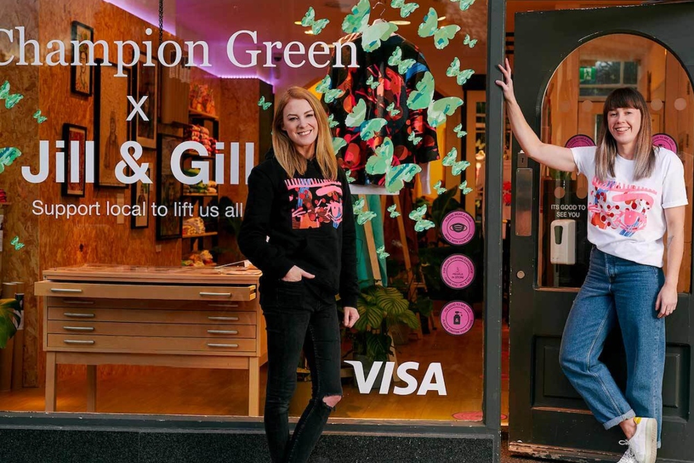 Two young women outside a design studio shop.