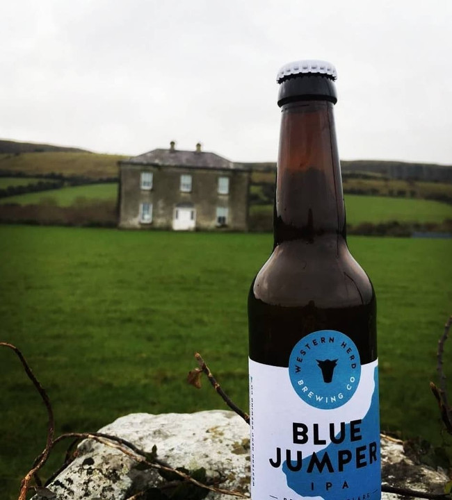 Beer bottled named Blue Jumper on a wall outside Father Ted's famous house on Craggy Island.