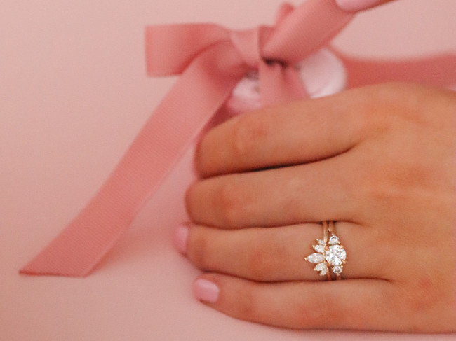 Woman wearing a diamond ring.