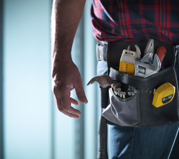 Employee wearing a safe tool belt about to go to work