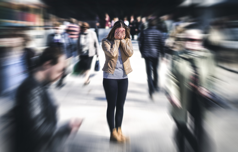 Woman feeling stressed in public