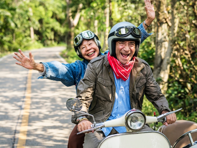 People riding on a motorbike.