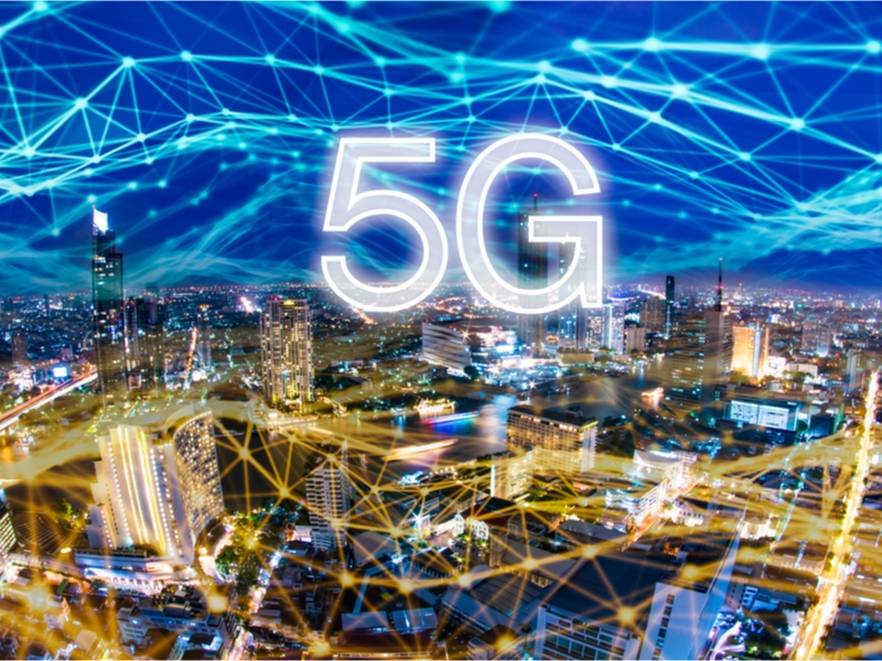 5G network digital hologram and internet of things on city background.