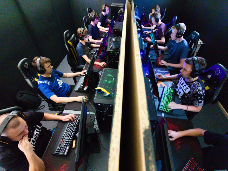 Rows of e-sports players at a tournament.