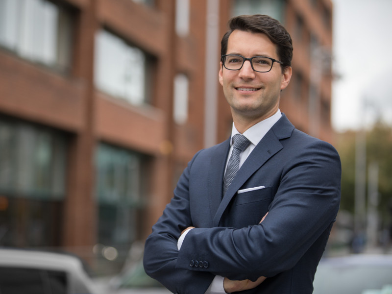 Well-dressed young man with glasses.