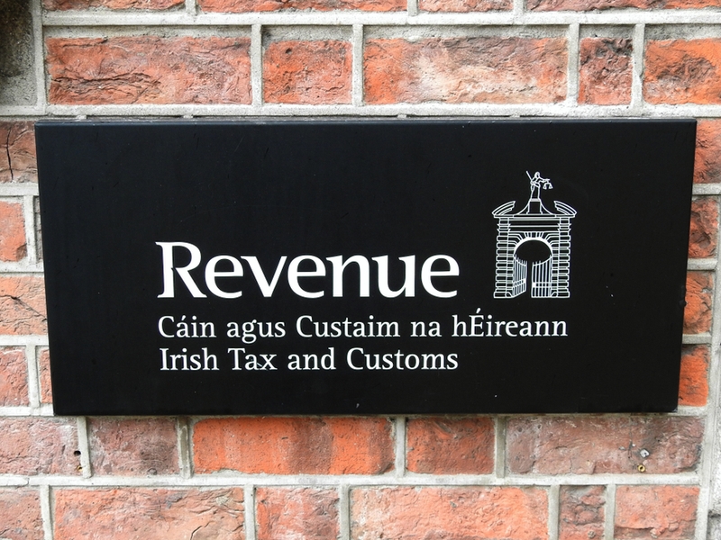 Revenue Commissioners brass plate on wall in Ireland.
