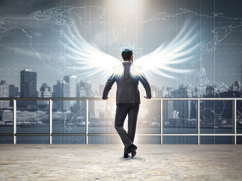 Businessman with angel wings.