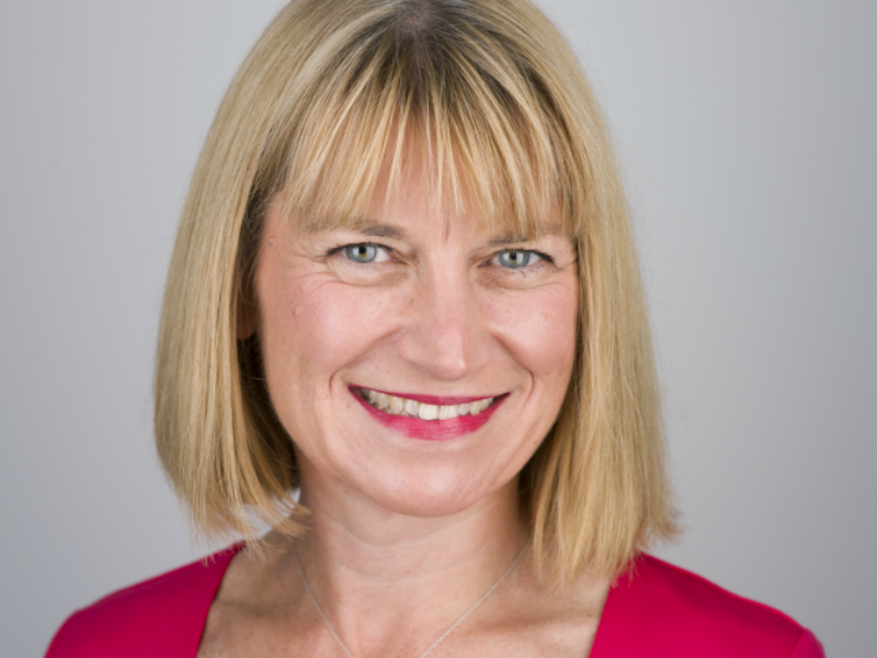 blonde haired woman in pink top.