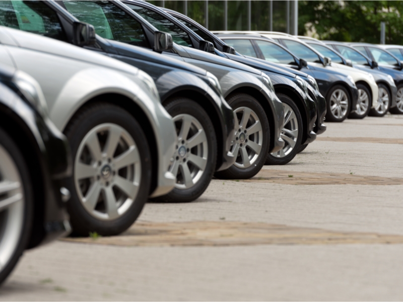 line of cars lined up at a motor dealership.