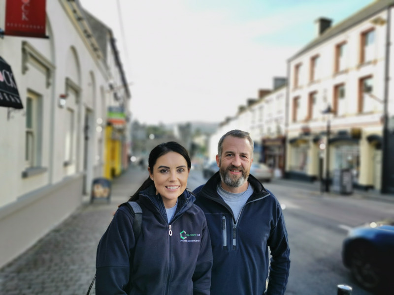 Young man and woman on a street in Ireland.