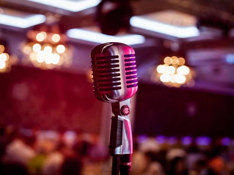 Vintage microphone in front of an audience.