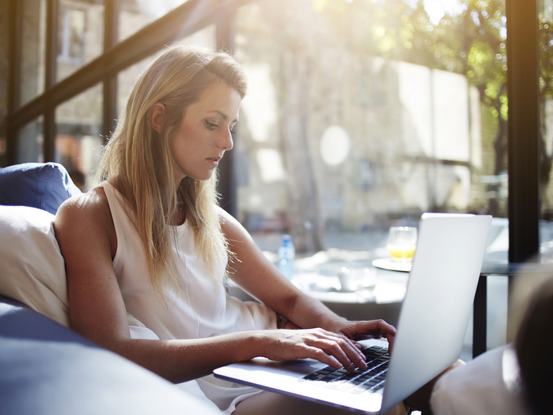 Woman working on computer at home.