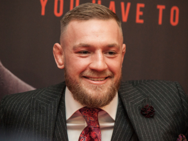 Boxer Conor McGregor in a suit.