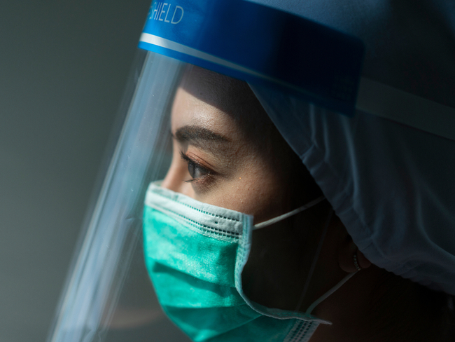 doctor wearing a face shield and mask.