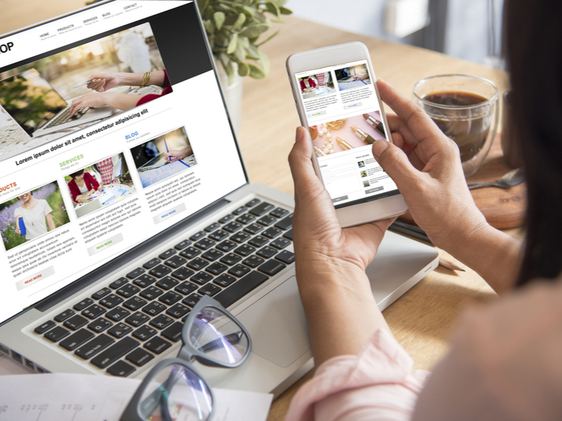 Woman shopping on her mobile and laptop.