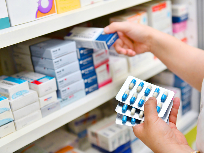 Pharmacist sorting pills.