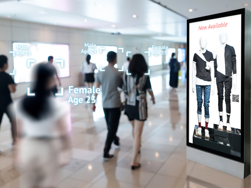 People walking through a digital shopping mall.