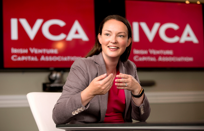 Woman gesturing with her hands.