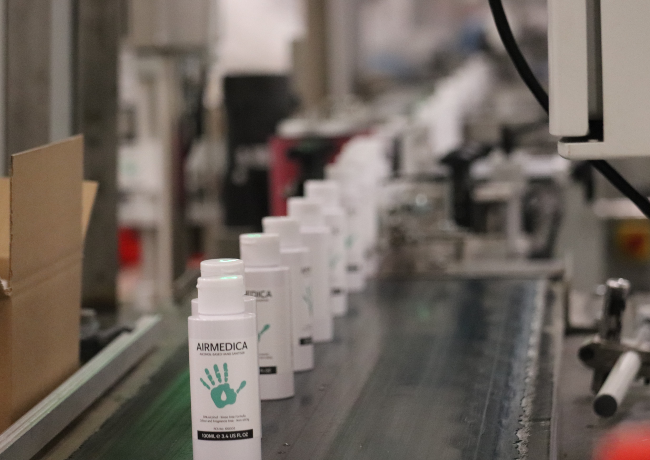 hand sanitiser on a conveyor belt.