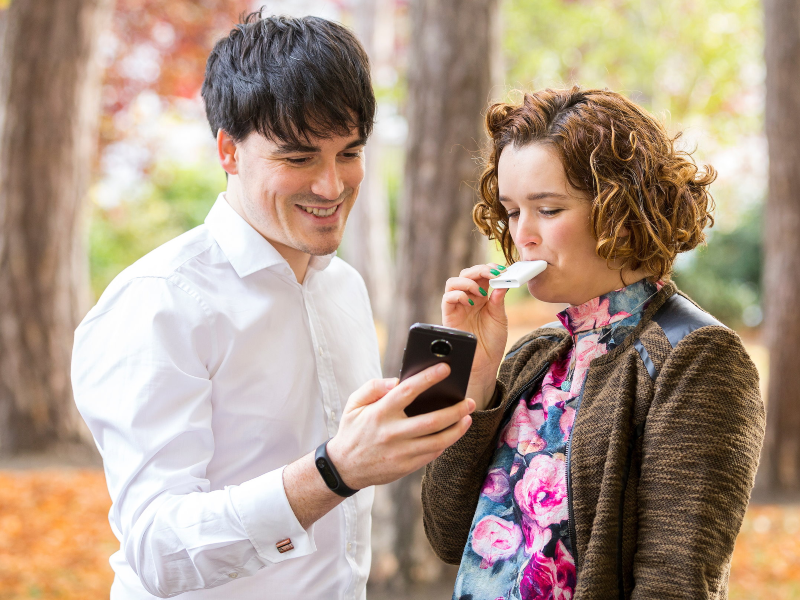Man and woman using a food digestive tracking device.
