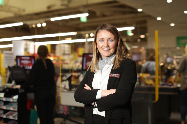 Woman retail worker in SuperValu Blackrock.