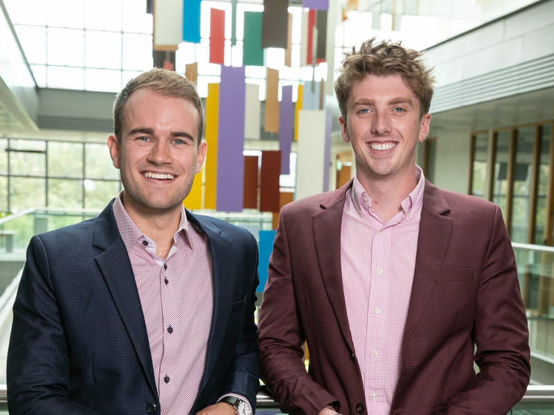 Two young men in suits.