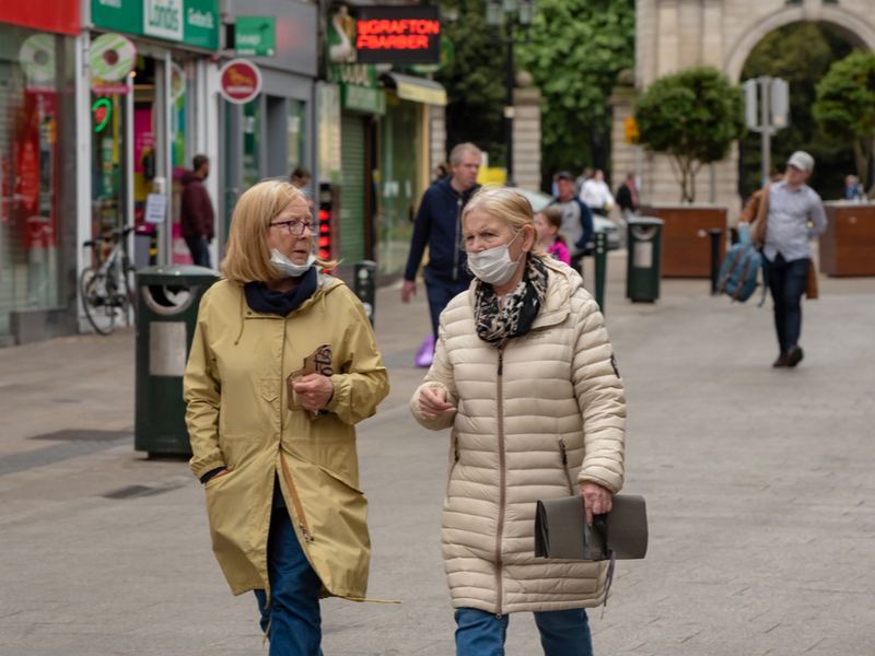 Two women walk down a deserted Grafton Street during Covid-19 lockdown.