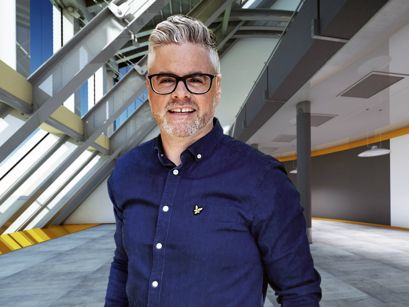 Man with glasses and a blue shirt.