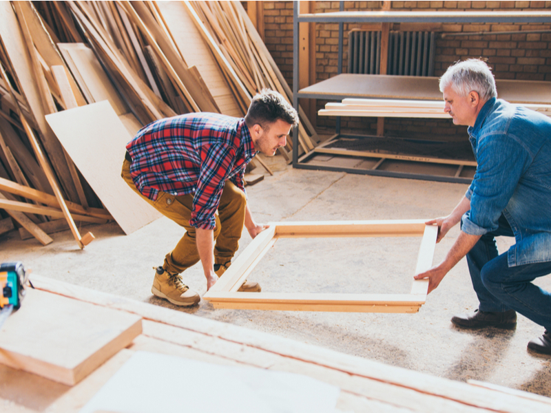 Father and son working on a carpentry business.