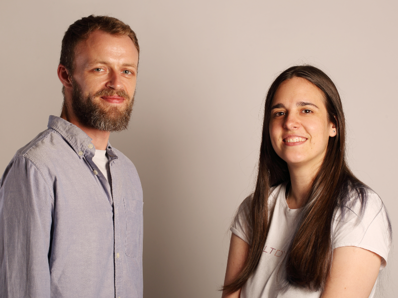 Man with beard beside dark-haired woman.