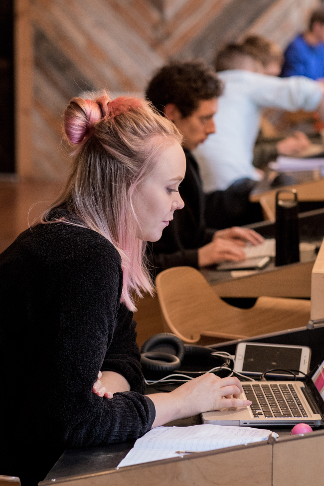 young woman working at a desk.