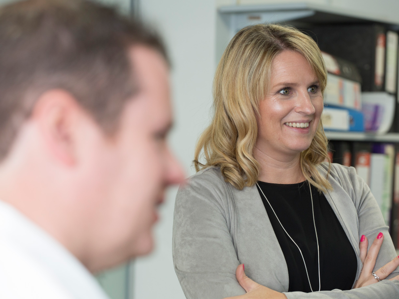 Dark-haired man beside blonde woman.