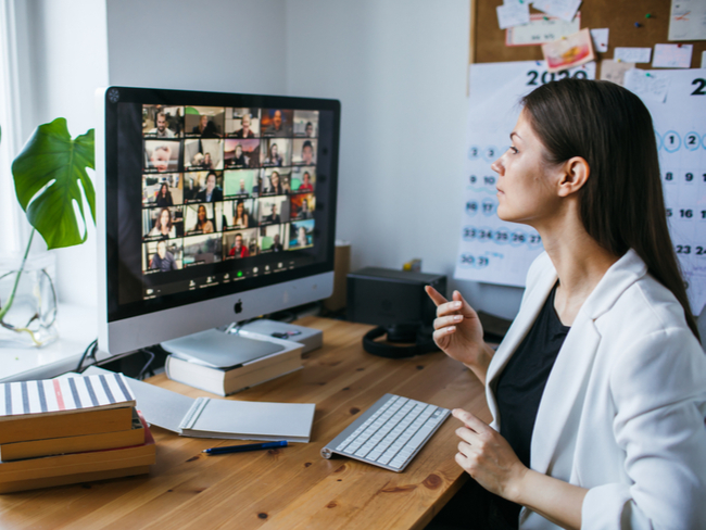 Woman attends a virtual event by Zoom.