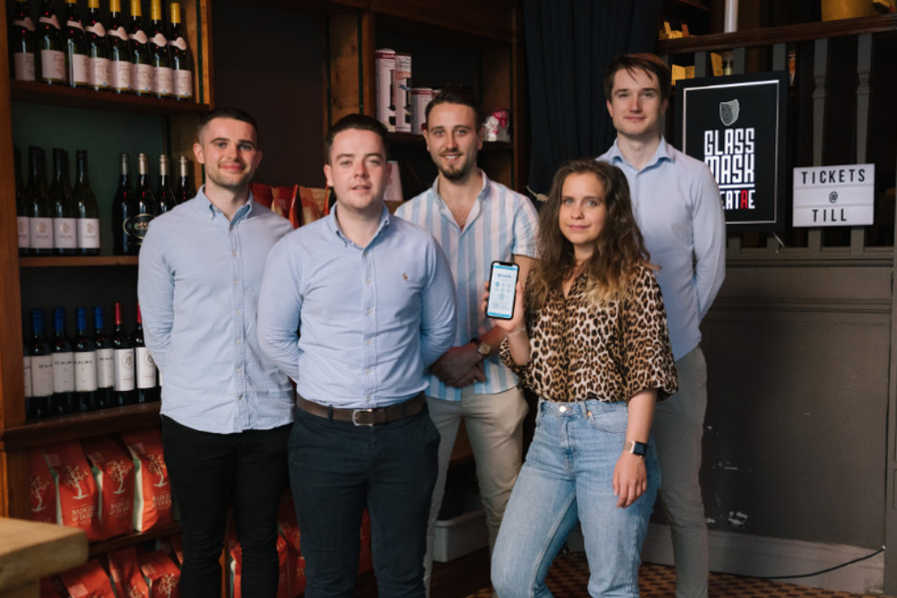 Four men and a woman in a wine bar.