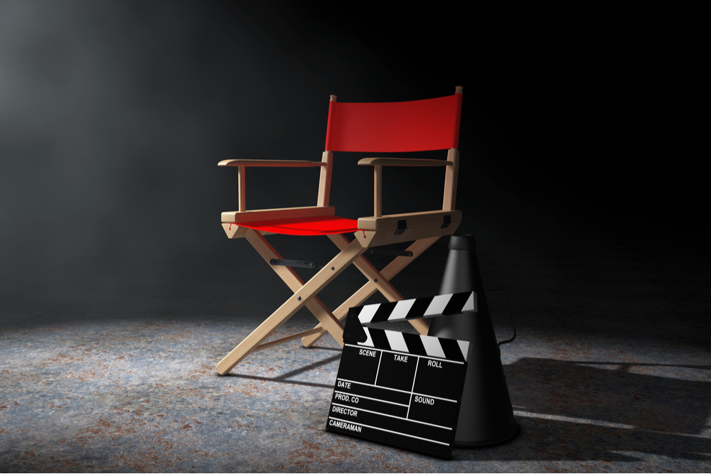 red-coloured director's chair with clapperboard.