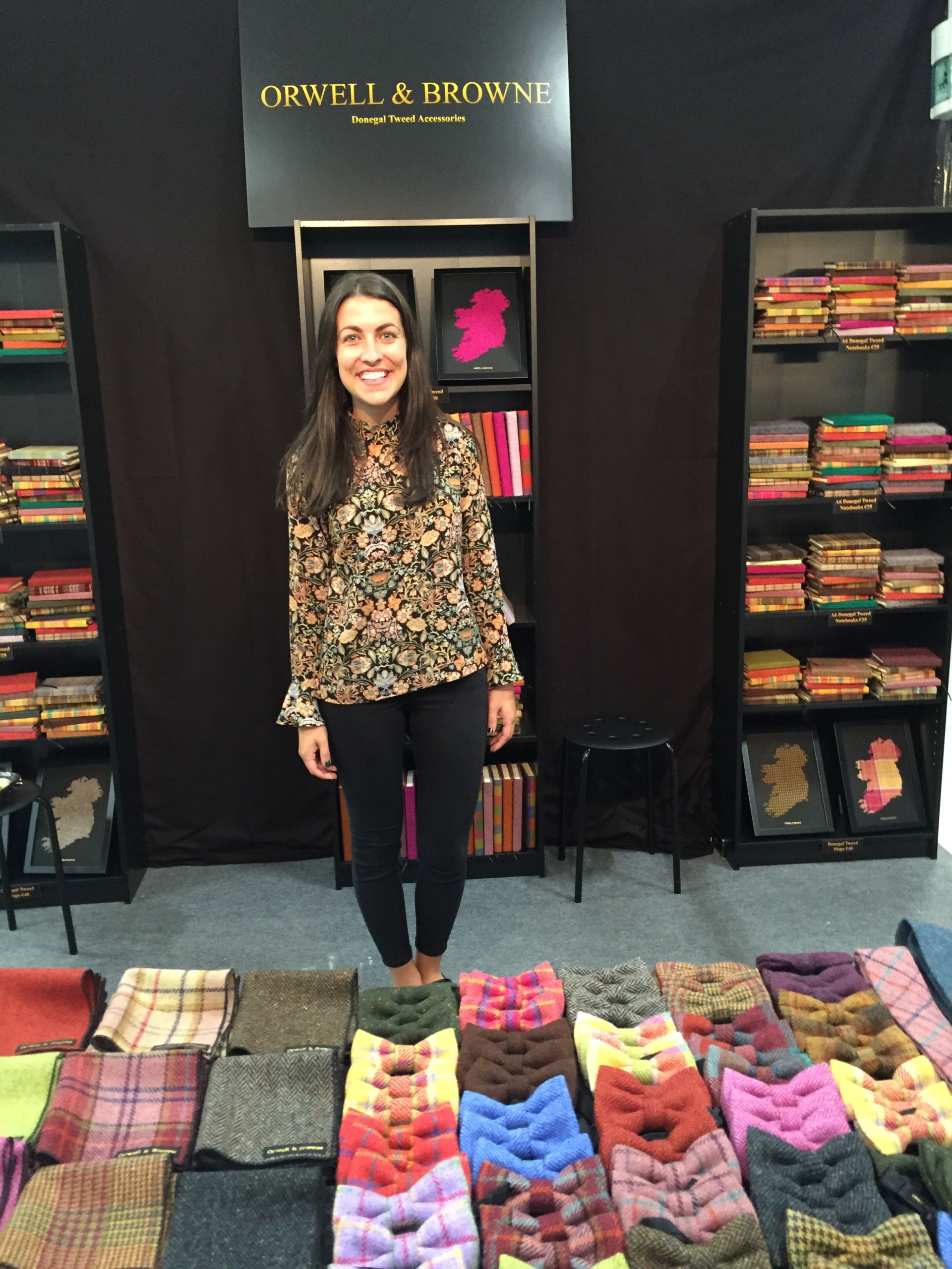 Woman standing in a clothes shop.