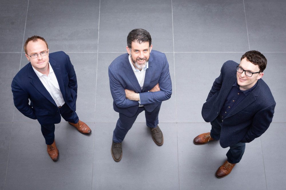 Three smart dressed men.