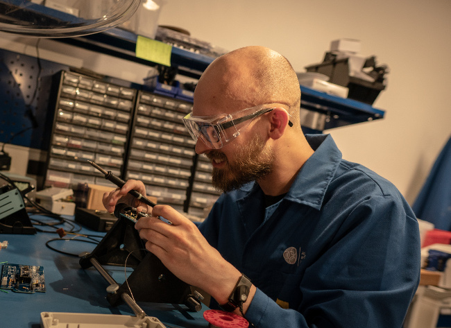 Man working with electronics.