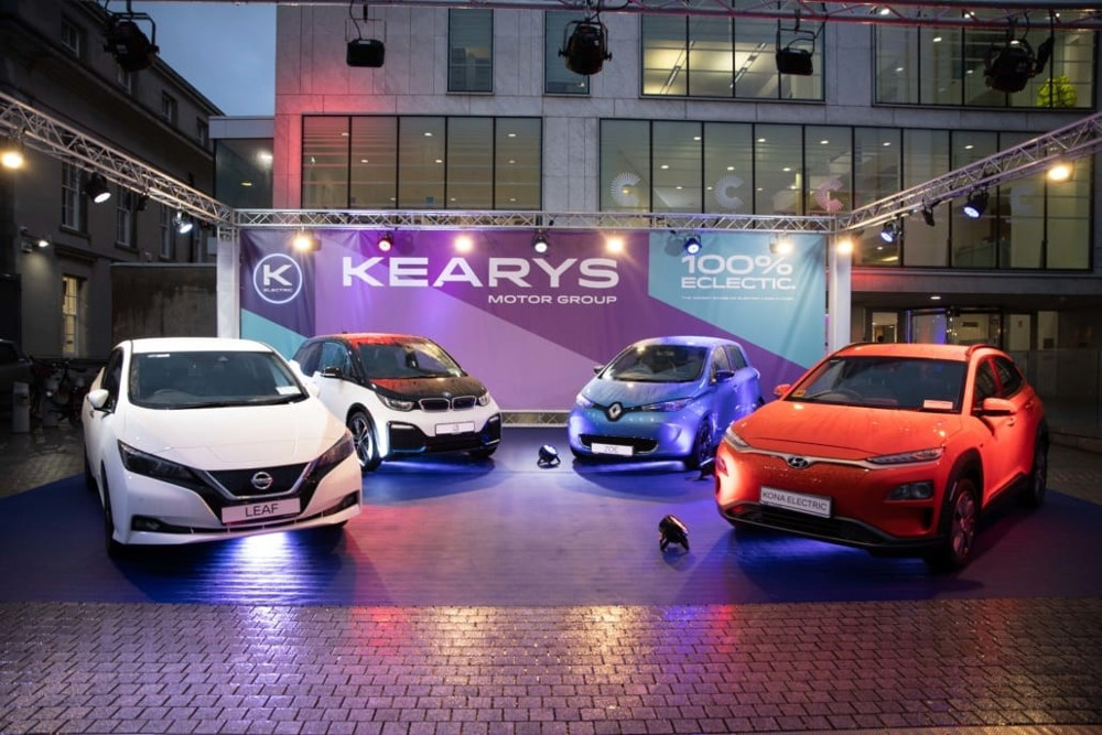 Electric car fleet at forecourt of car dealership.