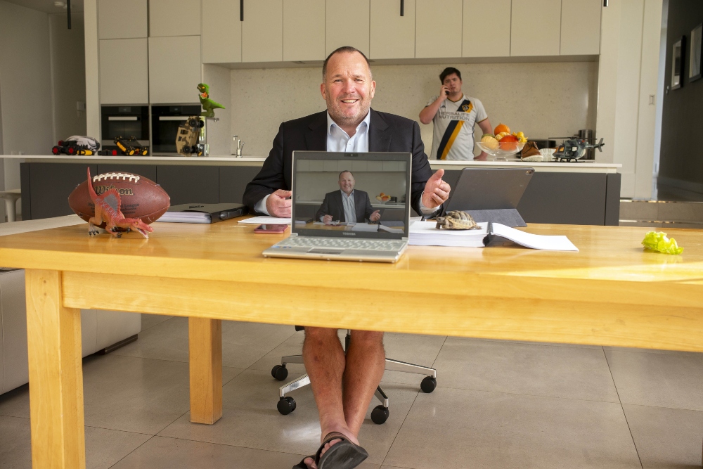 Man wearing shorts and a business suit.