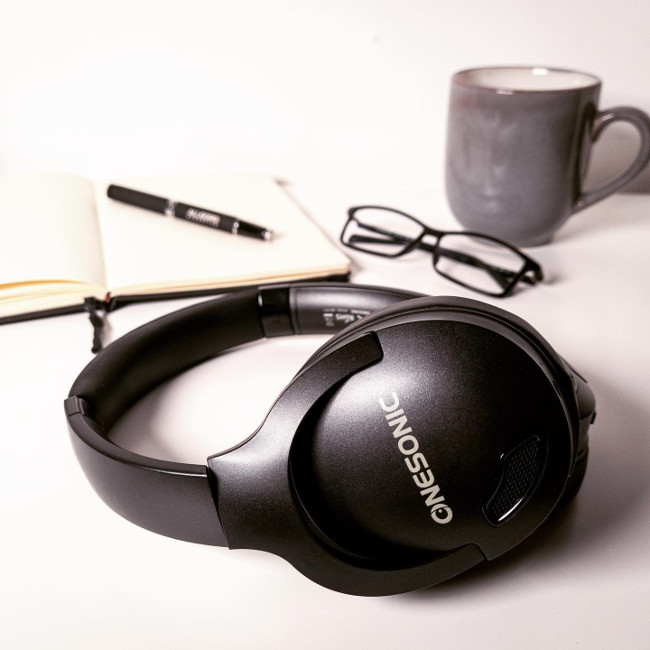 OneSonic headphones on a desk.