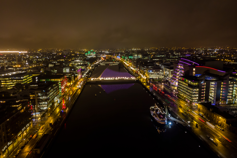 Dublin city lit up at night.