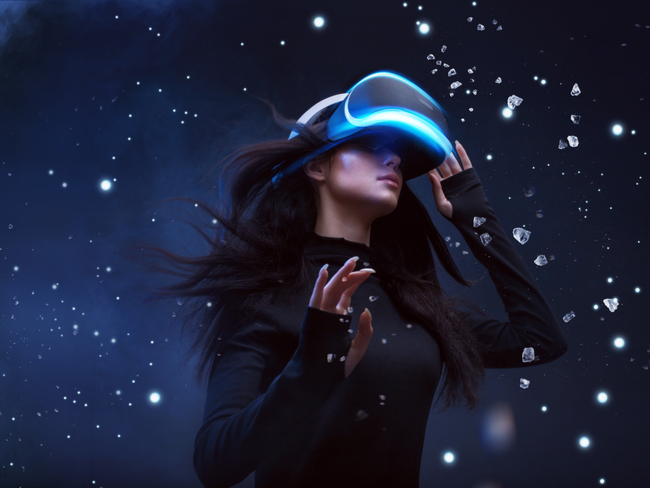 Woman wearing VR headset.