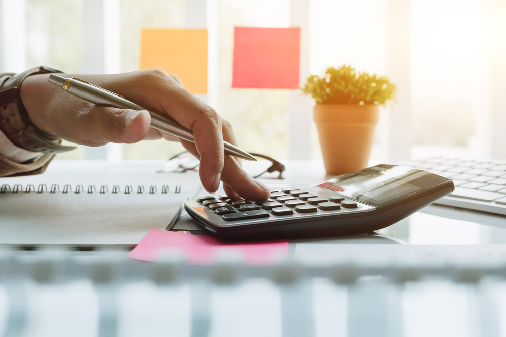 woman using a calculator.