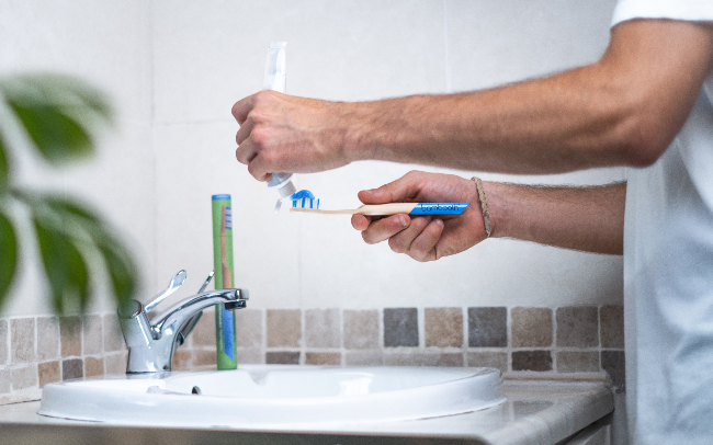 Man using Bambooth toothbrush.