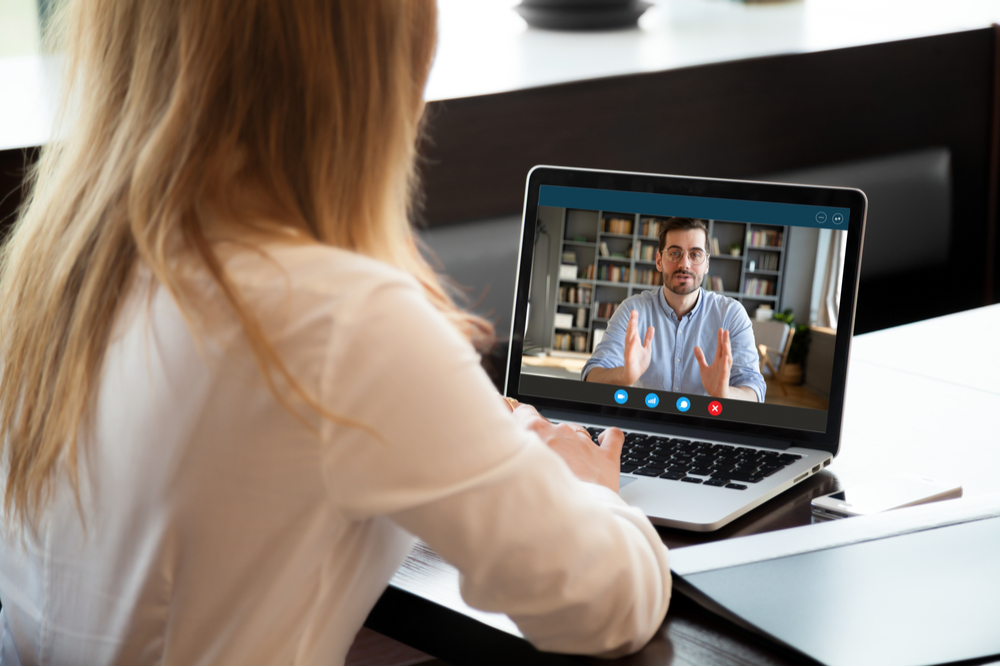 Line manager and colleague having a video conversation.