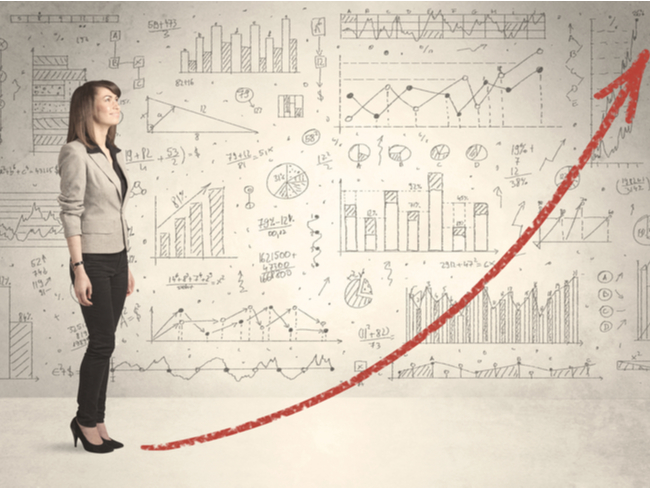 Woman standing in front of a scale-up curve.