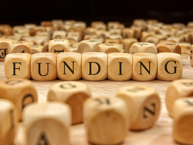 The word funding written on wooden blocks.