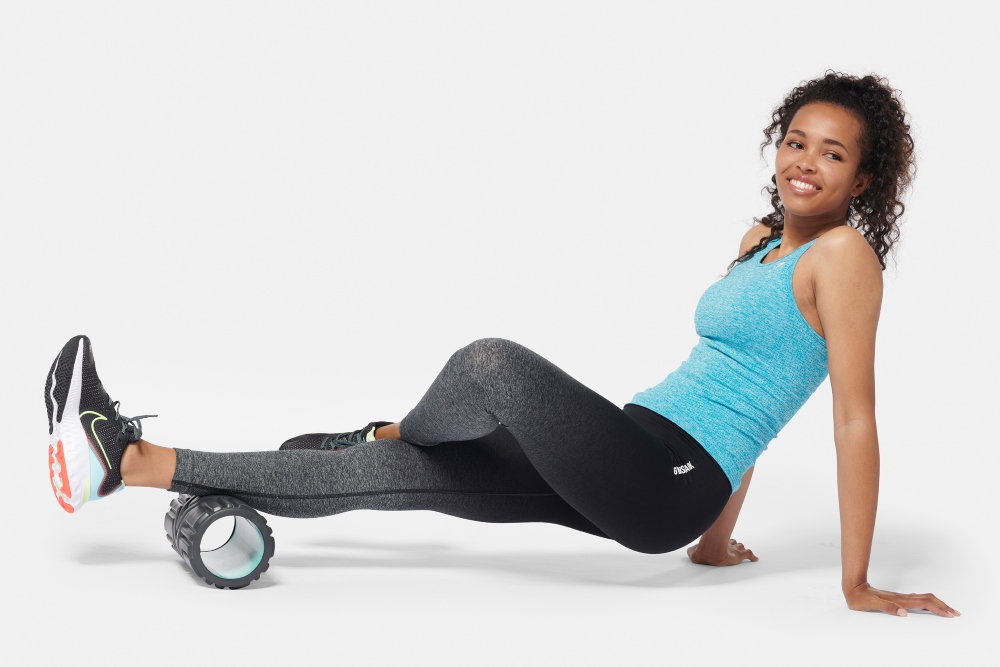 Woman exercising with Fizfit exercise device.