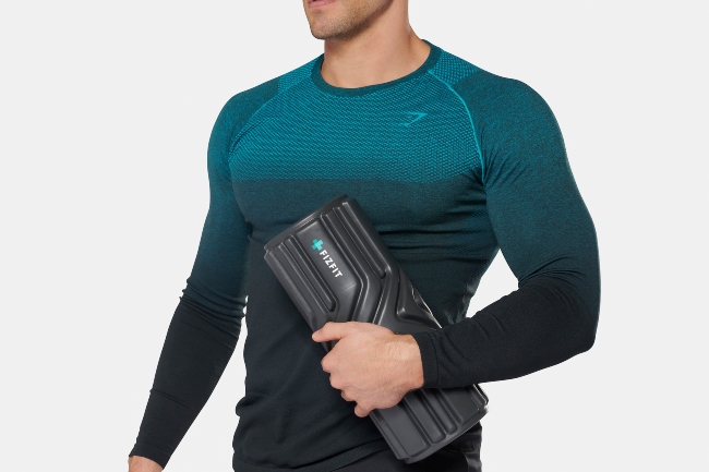 Man holding Fizfit exercise device.
